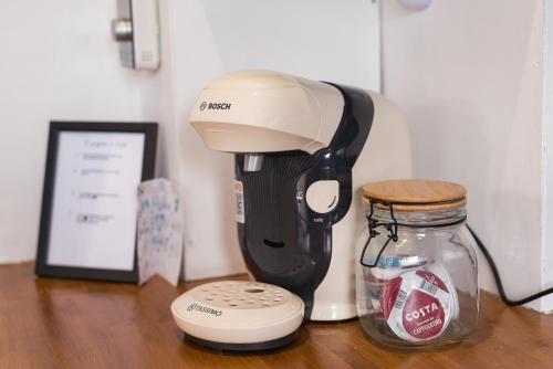a coffee maker and a mixer sitting on a table at Superb Beverley 3 Bedroom House with Private Parking and Garden - The Nicholson in Beverley