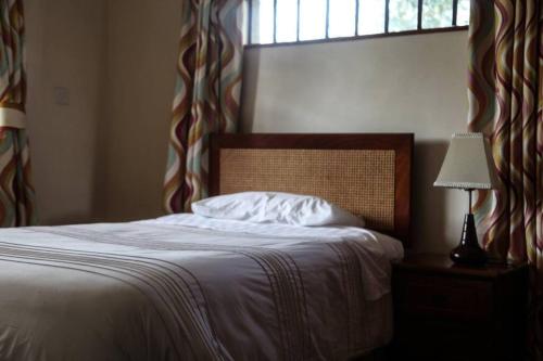 Posteľ alebo postele v izbe v ubytovaní Mayhill West Cottage
