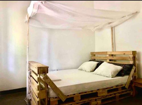 Postel nebo postele na pokoji v ubytování House Tanzania