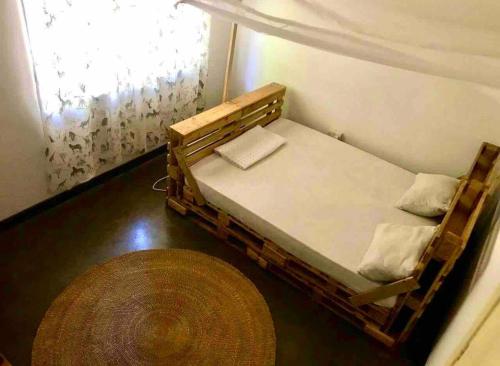 Postel nebo postele na pokoji v ubytování House Tanzania