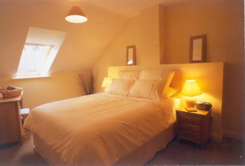 Säng eller sängar i ett rum på Holiday Home with view of Kenmare Bay Estuary