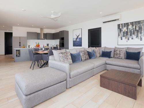 a living room with a couch and a table at Hermosa Bay Oceanview Villa in Boca Chica