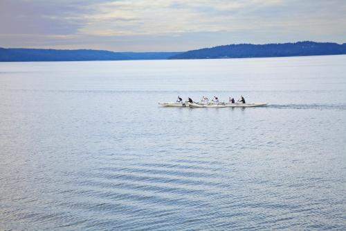 a group of people in a boat on the water at Silver Cloud Hotel Tacoma Waterfront in Tacoma