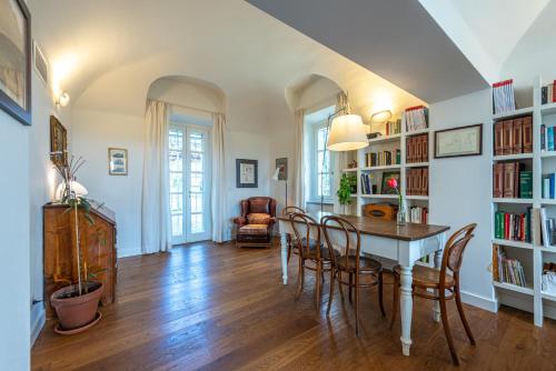 a dining room with a table and chairs at Casa Rita, Charming House with pool, Asti in Asti