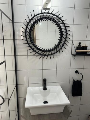 a bathroom with a white sink and a mirror at Central House in Plaka in Athens