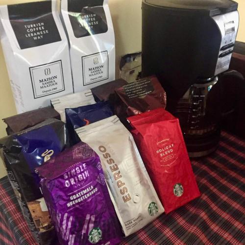 a pile of different types of chocolate on a table at TGH Guest House Badian in Badian