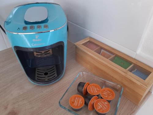 a toaster sitting next to a container of orange slices at Wohlfühlwohnung in Rappottenstein