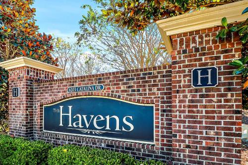a sign for the hawreens sign on a brick wall at Havens #1123 condo in North Myrtle Beach