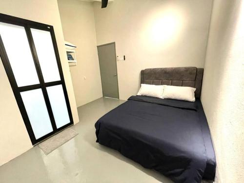 a bedroom with a bed and a large window at 4-10Pax The Subang Premium House - The Heart Of Subang in Subang Jaya