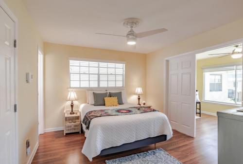 a bedroom with a bed and a window at Stylish Condo with a view of the water in Dauphin Island