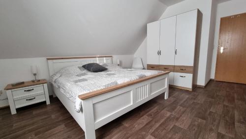 Katil atau katil-katil dalam bilik di Gästehaus Hoofdmann Ferienwohnungen