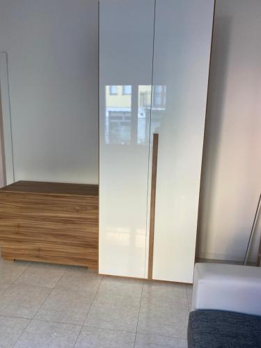 a room with a sliding glass door and a bed at Ale.Zelo Apartment in Zelo Buon Persico