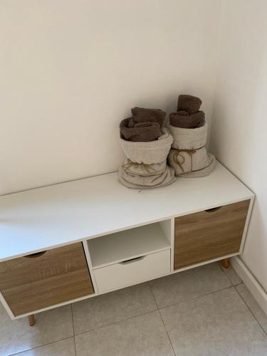 two baskets sitting on top of a white shelf at Ale.Zelo Apartment in Zelo Buon Persico
