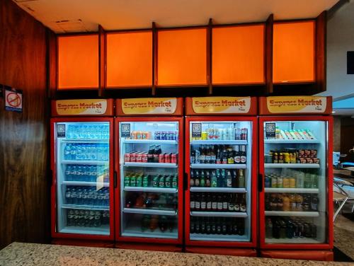 a refrigerator filled with lots of drinks at Reymar Hotel Maceió in Maceió