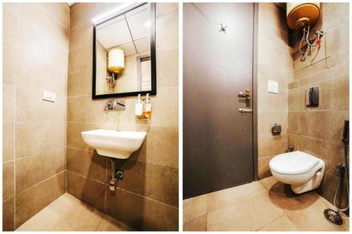 a bathroom with a toilet and a sink and a mirror at Hotel Roayal International By Le Cashew Rooms in New Delhi