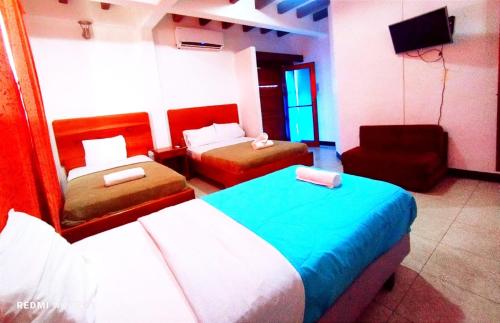 Un pat sau paturi într-o cameră la Hostal GalaHouse
