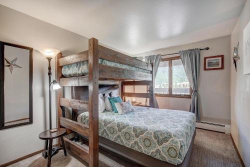 a bedroom with a bunk bed and a window at MTN View - Close to Lifts - Heated Pool - Copper in Wheeler Junction
