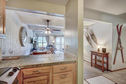 a kitchen with a counter and a living room at MTN View - Close to Lifts - Heated Pool - Copper in Wheeler Junction