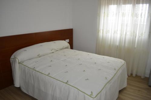 Ένα ή περισσότερα κρεβάτια σε δωμάτιο στο Apartamento TERRAS VELLAS
