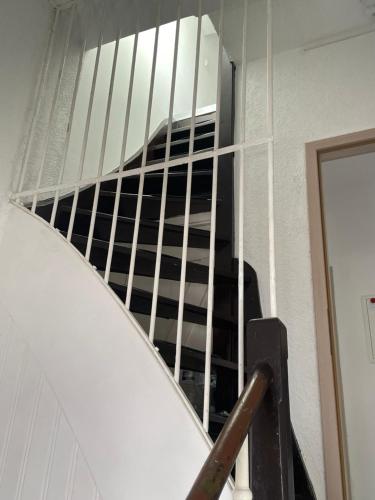 a stair case in a building with a window at Dach Zimmer D1 in Falkenberg