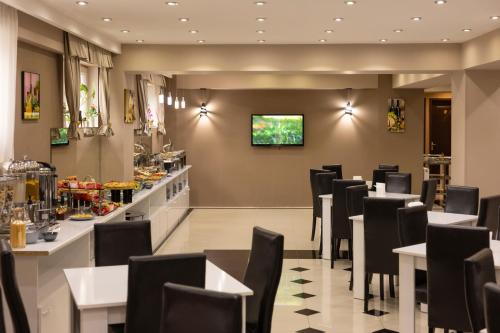 Hotel Grand Palaceにあるテレビまたはエンターテインメントセンター