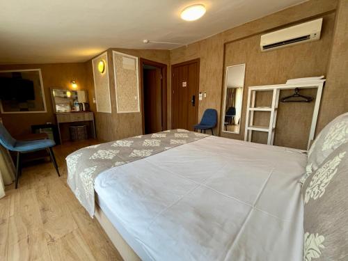 a bedroom with a large white bed in a room at Meydan Suites in Istanbul