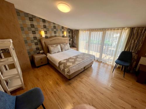a small bedroom with a bed and a window at Meydan Suites in Istanbul