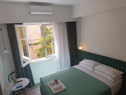 Ένα ή περισσότερα κρεβάτια σε δωμάτιο στο MUSES LUXURY SUITES