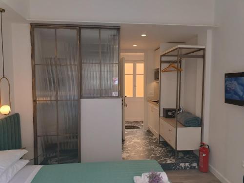 Ένα ή περισσότερα κρεβάτια σε δωμάτιο στο MUSES LUXURY SUITES