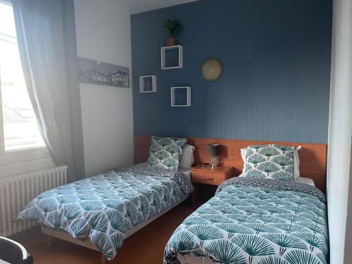 Łóżko lub łóżka w pokoju w obiekcie Le Palace