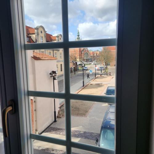a view of a city street from a window at Soul House Gdansk Old Town in Gdańsk