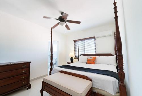 a bedroom with a bed and a ceiling fan at Breathtaking 3-2 with Ocean View in Las Flores