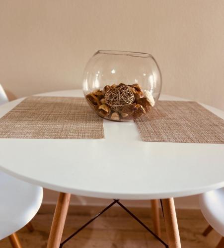 a glass bowl on top of a white table at Central House Karistos Two in Karistos
