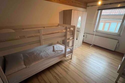 a bedroom with two bunk beds in a room at House in Sarstedt! contactless check-in 20P in Sarstedt
