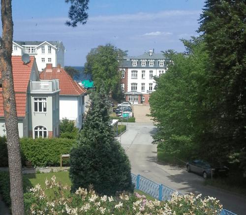 a view of a street with houses and trees at Zinnowitz, Fewo Sonnendomizil in Zinnowitz