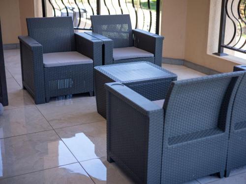 a group of chairs and tables on a patio at Khutso Boutique Hotel in Hazyview