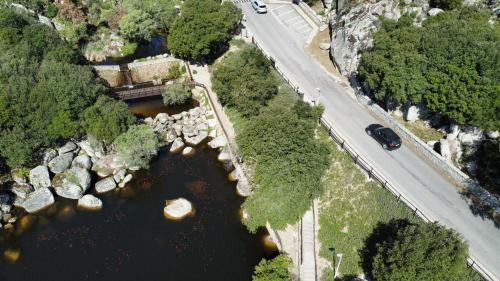 an aerial view of a river with a bridge at Stazzo Casa Bianco Fly in Aggius