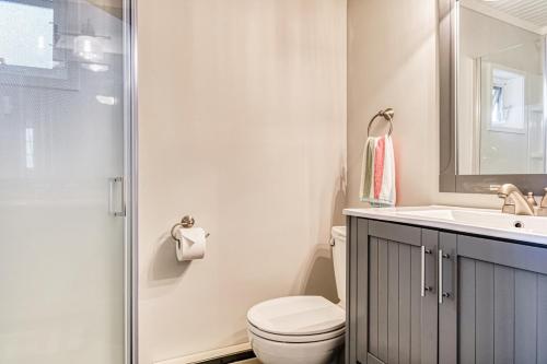a bathroom with a toilet and a sink and a shower at Half Shell, Unit 2 in Point Roberts
