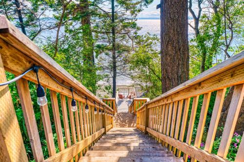a wooden bridge with stairs leading down to the water at Half Shell, Unit 2 in Point Roberts
