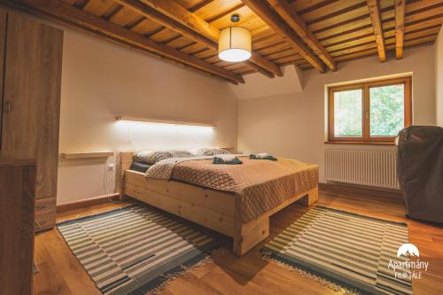 Ένα ή περισσότερα κρεβάτια σε δωμάτιο στο Apartmány Filip Tále