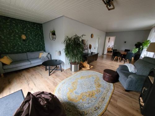 a living room with a couch and a table at Donner in Hollenstedt