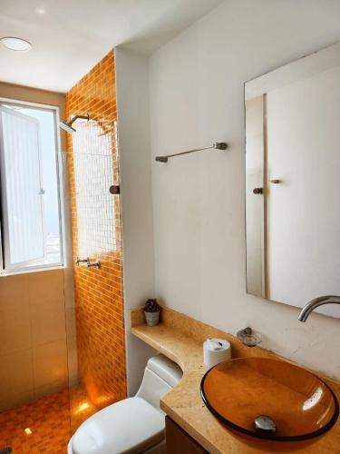 a bathroom with a wooden sink and a shower at Palmetto 2HABS vista de frente al mar. in Cartagena de Indias