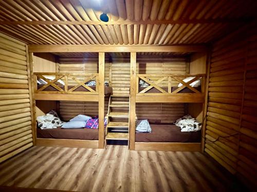 a room with two bunk beds in a cabin at Etno Selo Krnić in Vladimirci