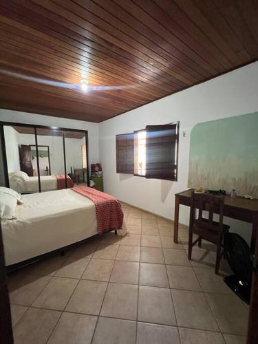 En eller flere senge i et værelse på Arraial Casa Vista Alegre