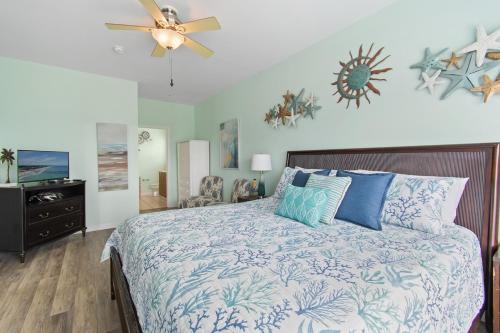 a bedroom with a bed and a ceiling fan at Key Rest in Oak Island
