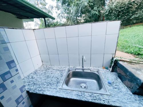 a kitchen sink with a faucet on a counter at Muhazi View Resort in Muhazi