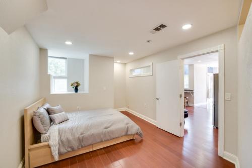 a white bedroom with a bed and a window at Comfy Aptos Apartment Near Beaches and Santa Cruz! in Aptos