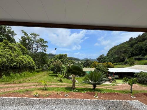 a view of the garden from the house at Tuna House in Maroe