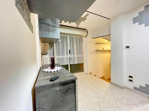 a kitchen with a counter top in a room at bilocale 40 mt dal mare 2 piani in Rimini