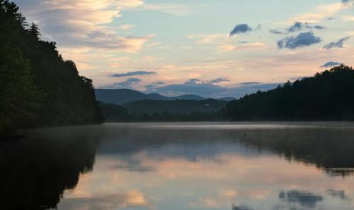 a view of a lake with trees and a cloudy sky at No Dog Fees - Dog Friendly 3BR 2BA with Loft and Mountain Views - Near Bryce Resort in Basye, VA in Basye